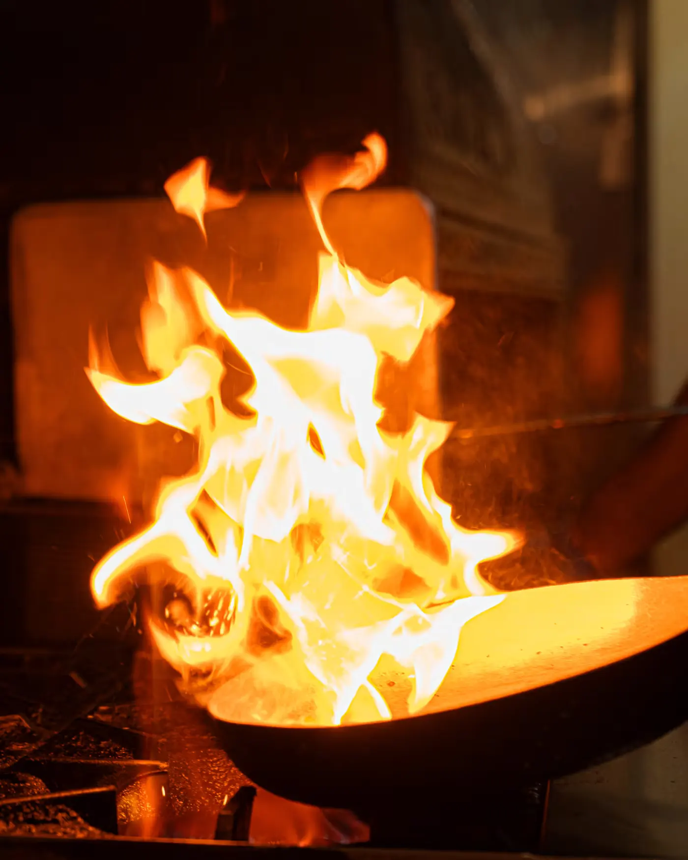 Flames rising from a pan in the Beirut Restaurant kitchen. Photographed by Gorka Di Capitan (gorkadicapitan.com).