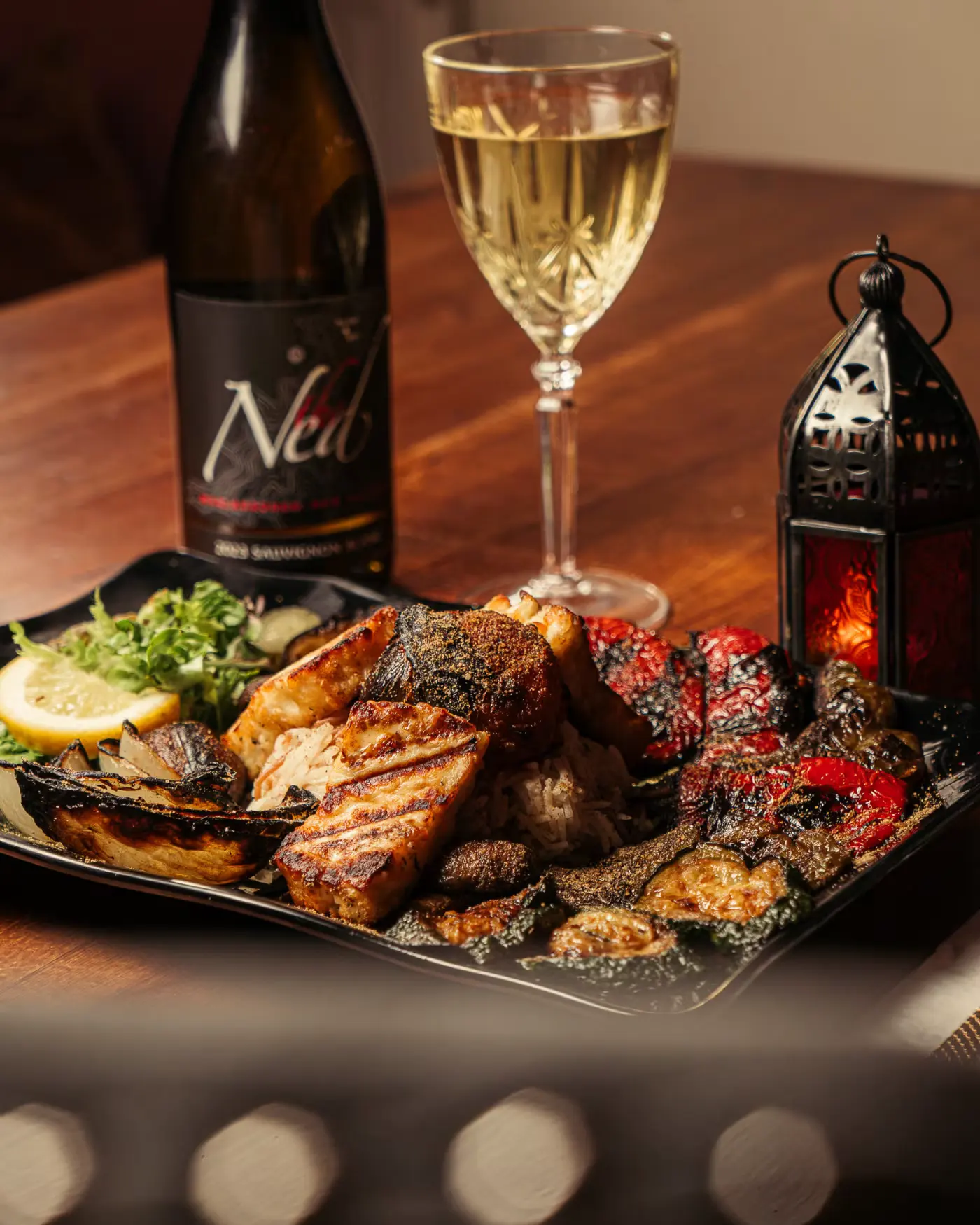 Grilled fish platter with white wine at Beirut Restaurant, captured by Gorka Di Capitan (gorkadicapitan.com), food photography