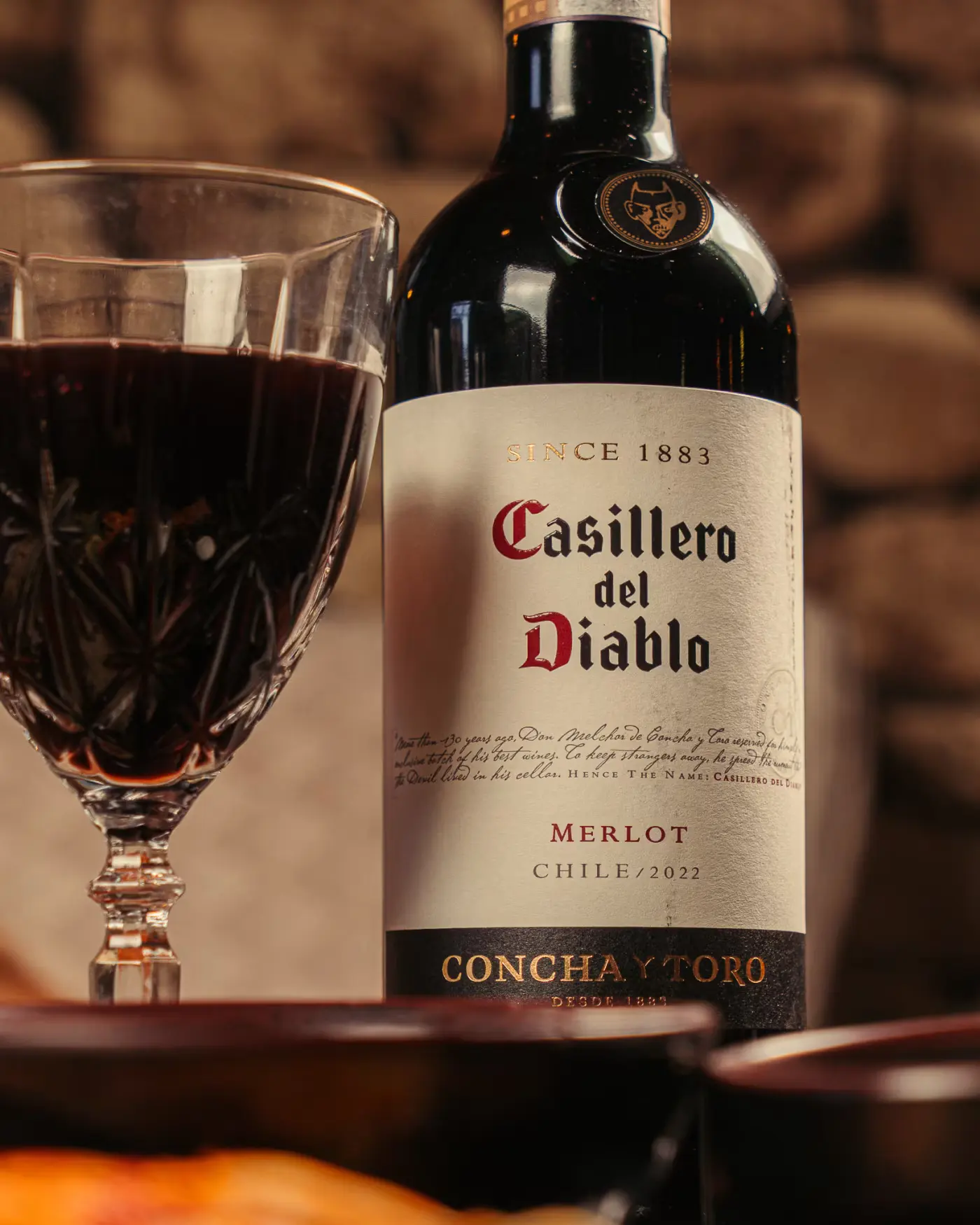 Glass of merlot beside the bottle at Beirut Restaurant. Photographed by Gorka Di Capitan (gorkadicapitan.com).