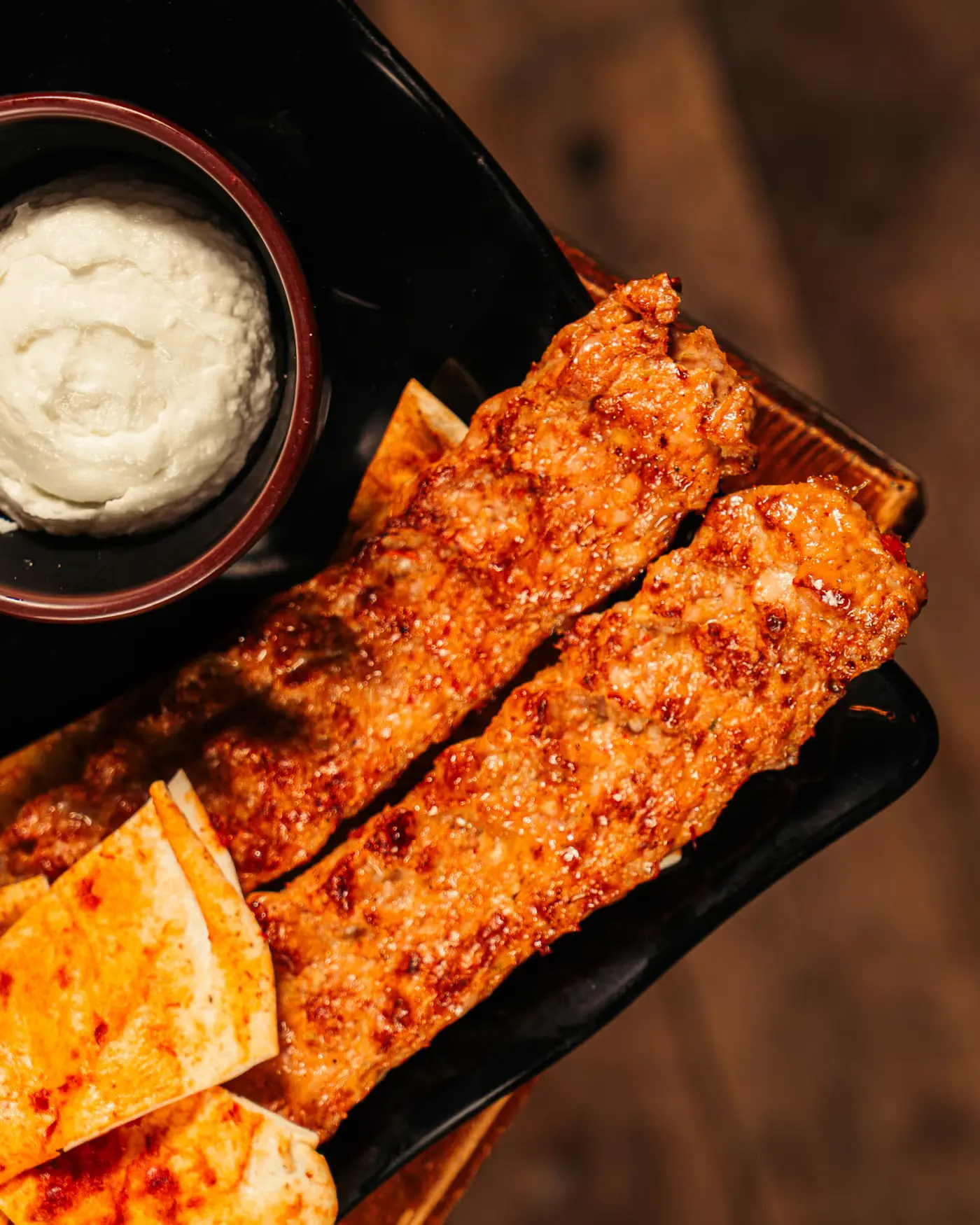 Kofta skewers with pita and garlic sauce at Beirut Restaurant, captured by Gorka Di Capitan (gorkadicapitan.com), food photography