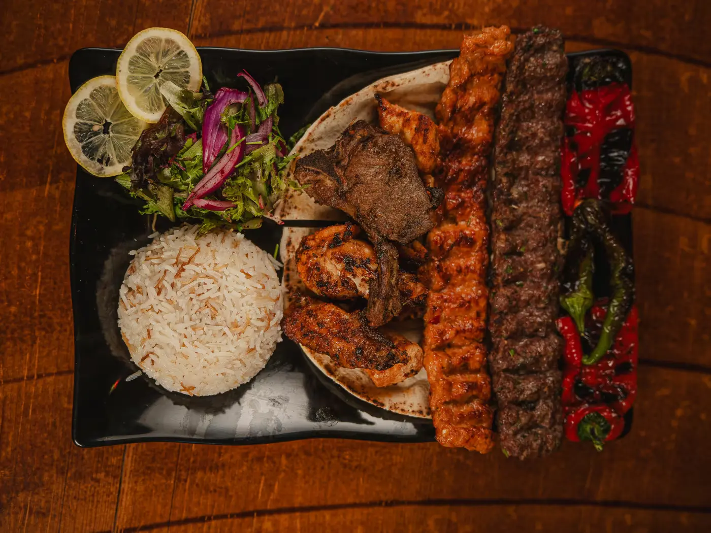 Overhead view of a kebab plate with rice, salad and flatbread at Beirut Restaurant, food photography session by Gorka Di Capitan (gorkadicapitan.com)