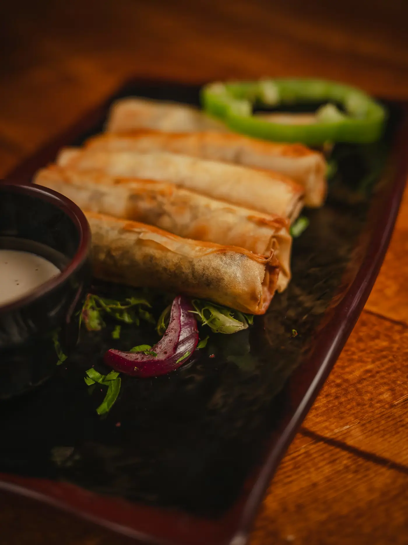 Crispy rakakat rolls with a green pepper and tahini dip at Beirut Restaurant, shot by Gorka Di Capitan (gorkadicapitan.com)